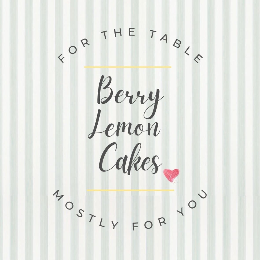 Hand-lettered sign on a styled party table