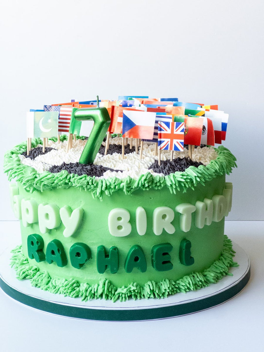 Green cake with world flag picks